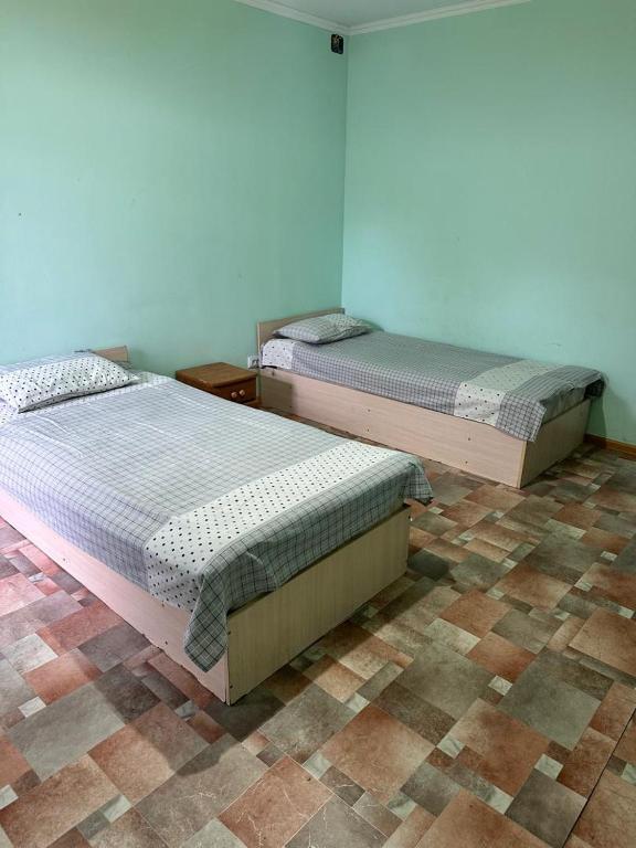 Postel nebo postele na pokoji v ubytování Kairat property