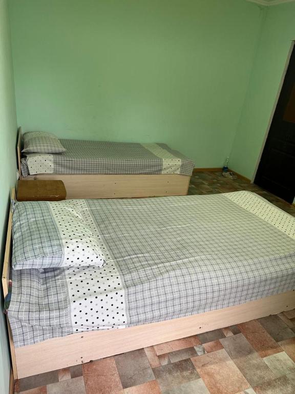 Postel nebo postele na pokoji v ubytování Kairat property