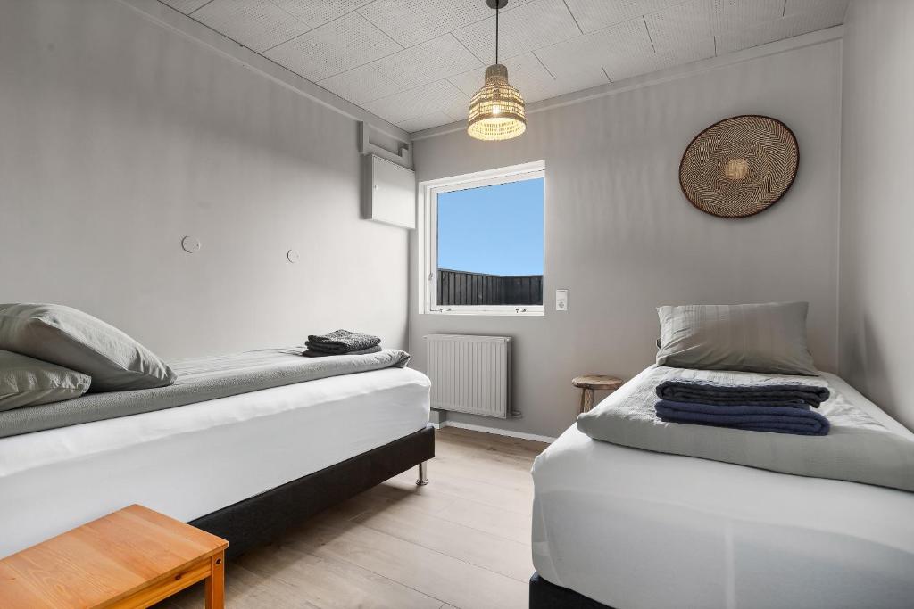 Postel nebo postele na pokoji v ubytování Ocean Break Cabins