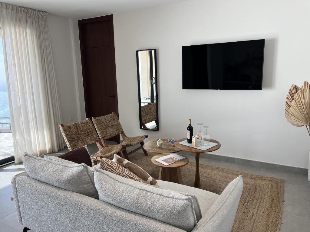 Μια τηλεόραση ή/και κέντρο ψυχαγωγίας στο Lujosa Suite En La Palma con Piscina