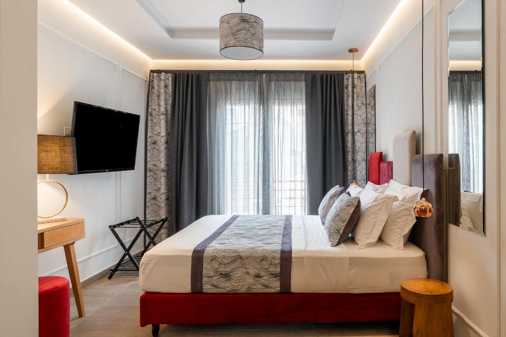 Łóżko lub łóżka w pokoju w obiekcie Garment District Suites