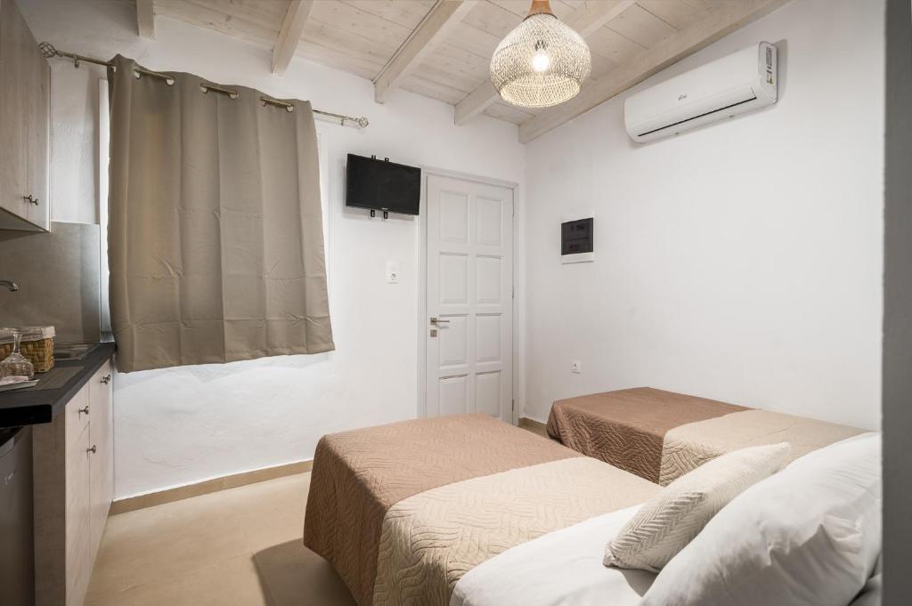 Postel nebo postele na pokoji v ubytování Albatross Apartments by Konnect, Ipsos Corfu