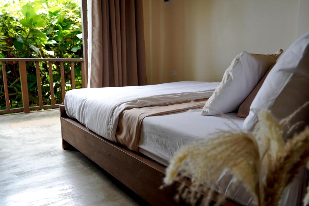 Giường trong phòng chung tại Villa Cila