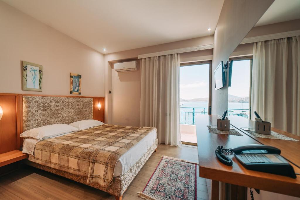 Postel nebo postele na pokoji v ubytování Hotel Kaonia
