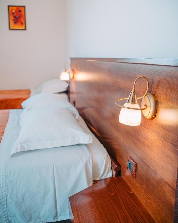Postel nebo postele na pokoji v ubytování Hotel Kaonia