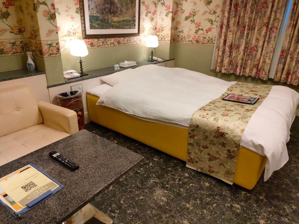 Postel nebo postele na pokoji v ubytování ホテル パレドフルー