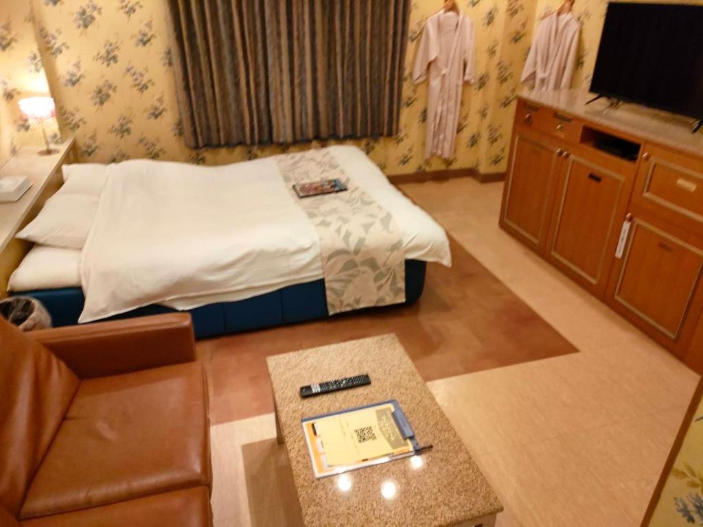Postel nebo postele na pokoji v ubytování ホテル パレドフルー