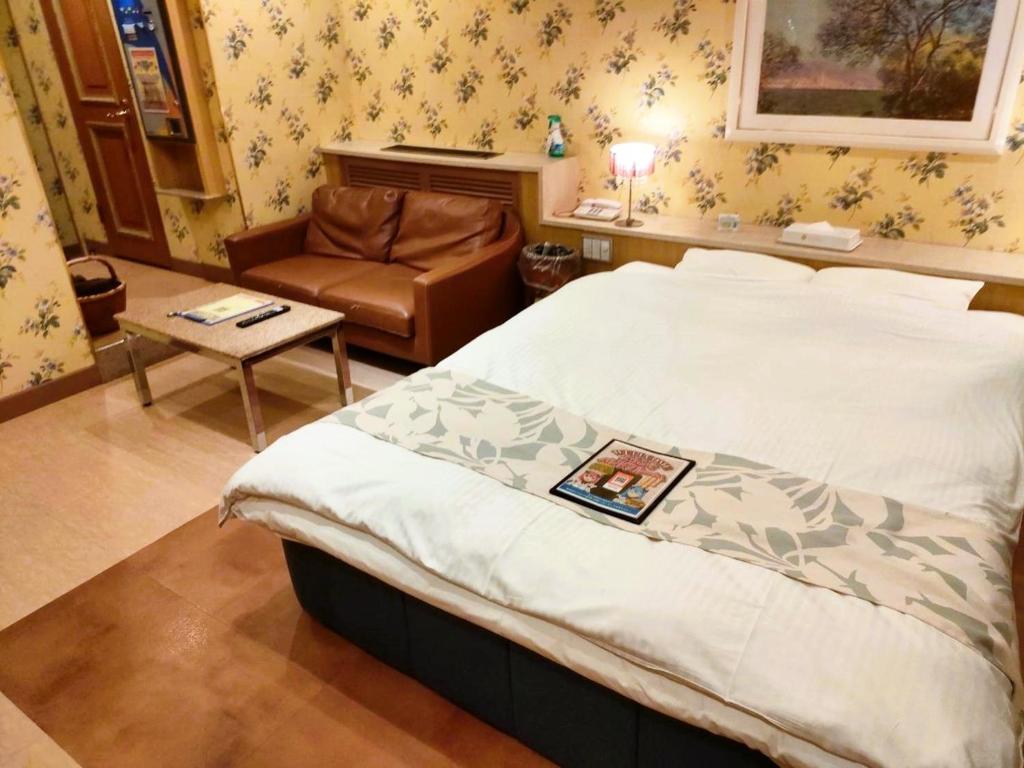Postel nebo postele na pokoji v ubytování ホテル パレドフルー