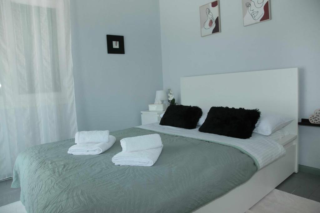 Ένα ή περισσότερα κρεβάτια σε δωμάτιο στο Marianne's Apartment