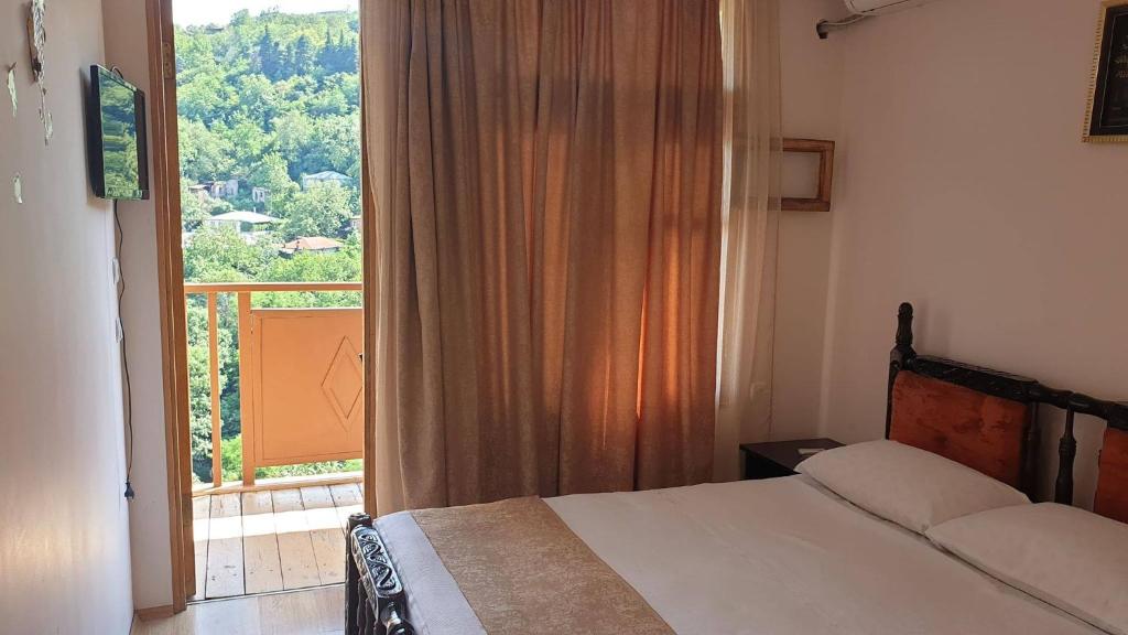 Postel nebo postele na pokoji v ubytování Sighnaghi Central