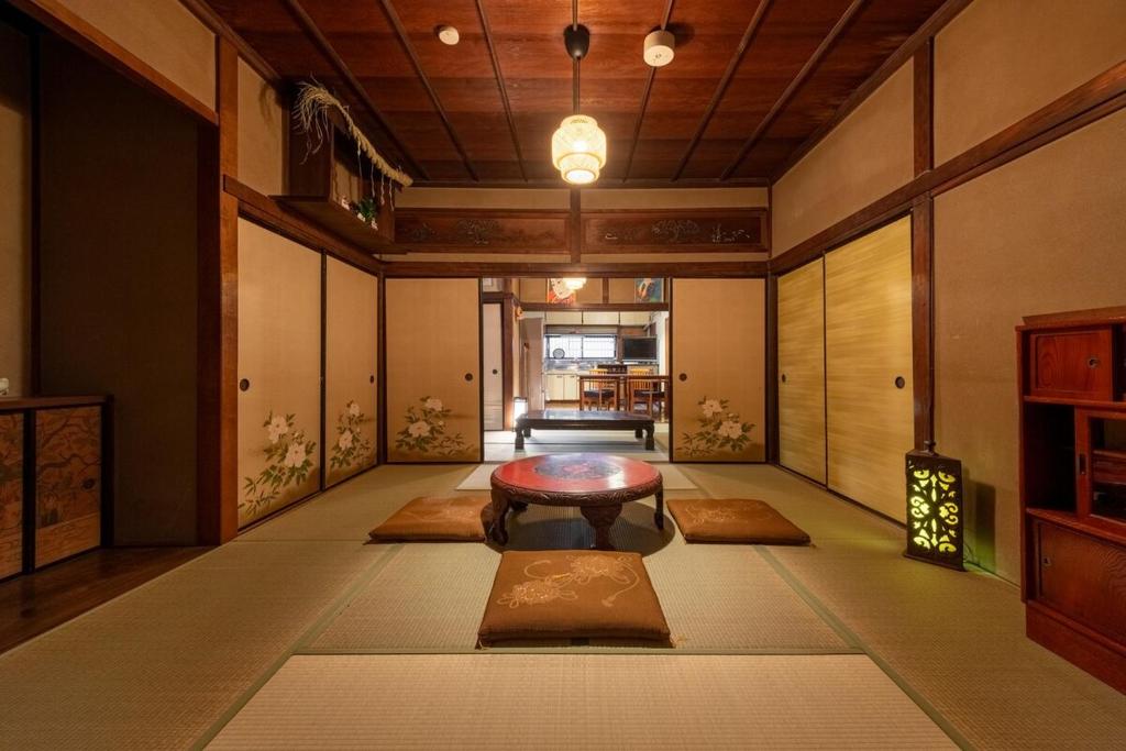 Postel nebo postele na pokoji v ubytování 関口邸