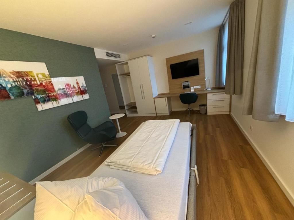 TV a/nebo společenská místnost v ubytování Leben wie im Hotel by Helios