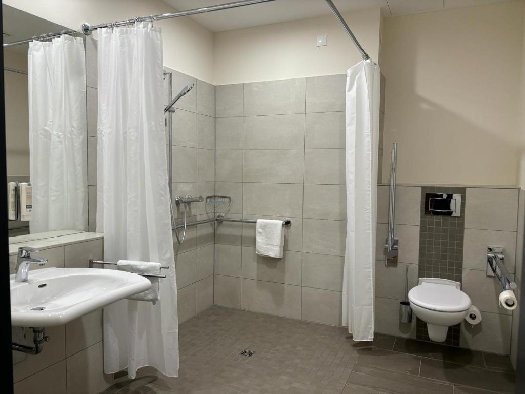 Koupelna v ubytování Leben wie im Hotel by Helios
