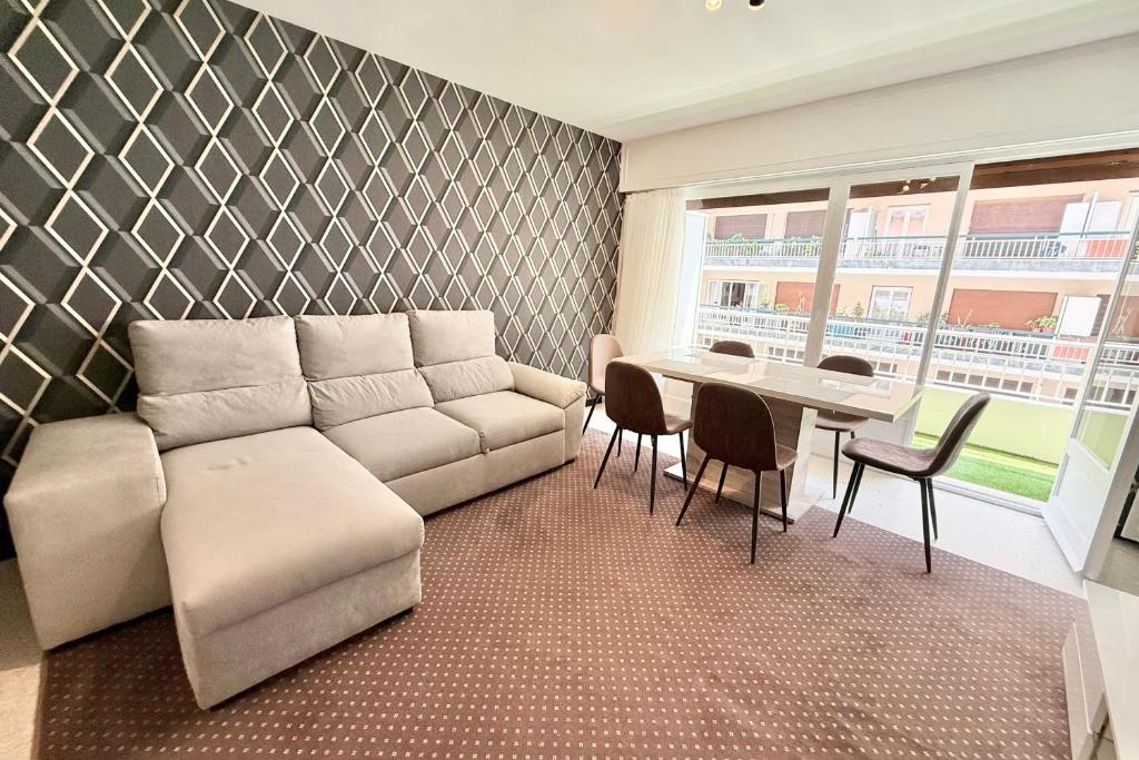 a living room with a couch and a table at Antibes hyper center - 4 people - close to shops and beaches in Antibes