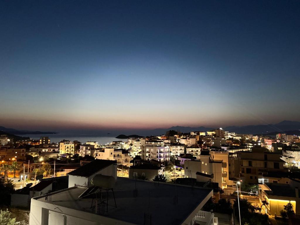 a view of a city at night at Villa Dion in Ksamil