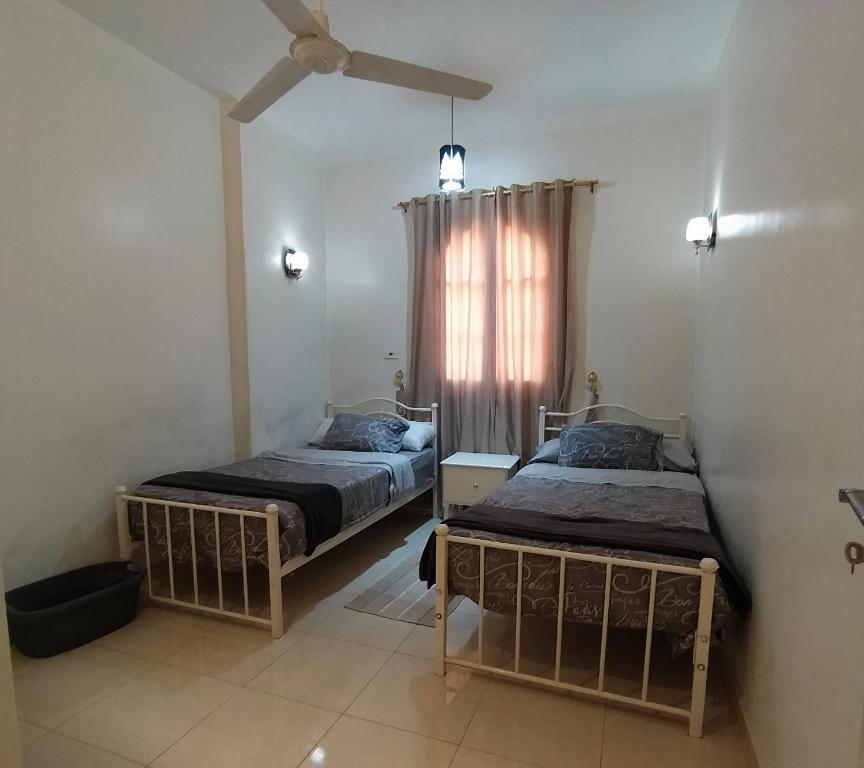 Ένα ή περισσότερα κρεβάτια σε δωμάτιο στο Luxor Palm Villa