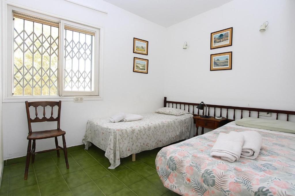 Łóżko lub łóżka w pokoju w obiekcie Casablanca Villas