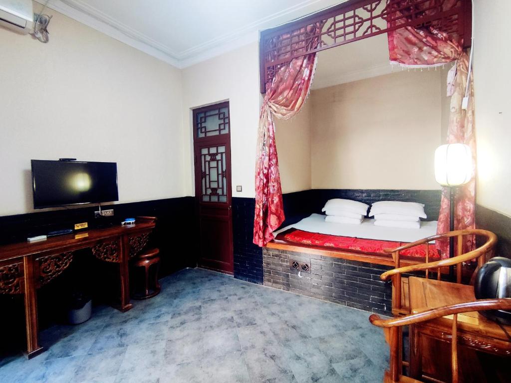 TV a/nebo společenská místnost v ubytování Pingyao Xiangshengyuan Guest House