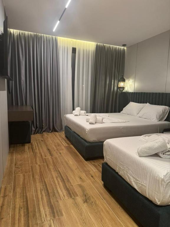 Postel nebo postele na pokoji v ubytování Hotel Lili-1