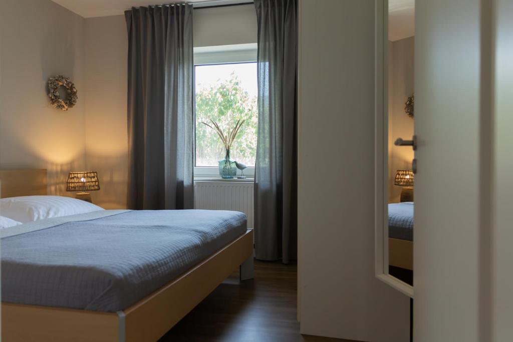 Ένα ή περισσότερα κρεβάτια σε δωμάτιο στο Ferienhaus Schilling am Steinhuder Meer