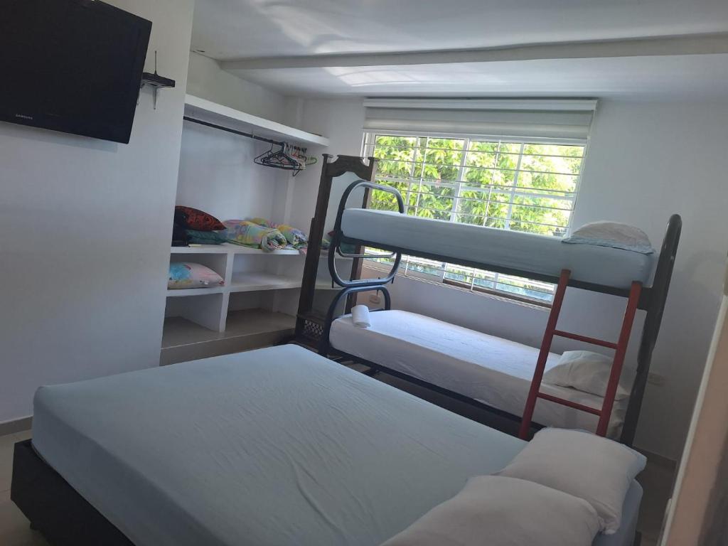 Llit o llits en una habitació de Hostal Mi Casita