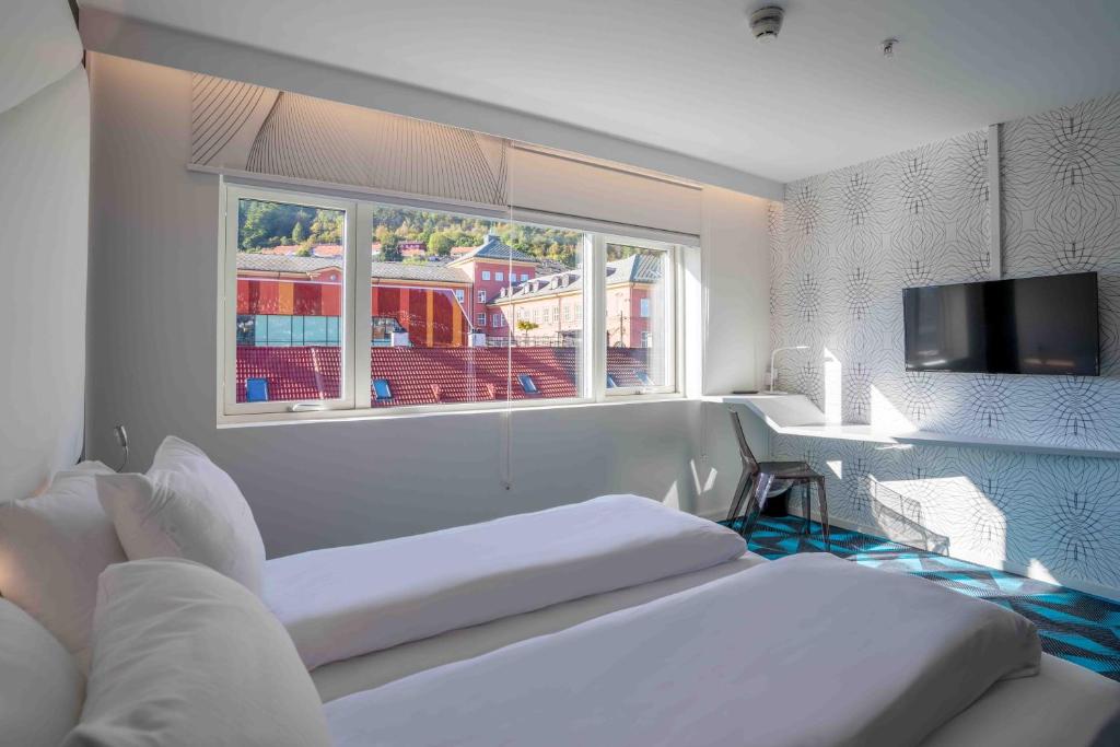 Postel nebo postele na pokoji v ubytování Magic Hotel Solheimsviken