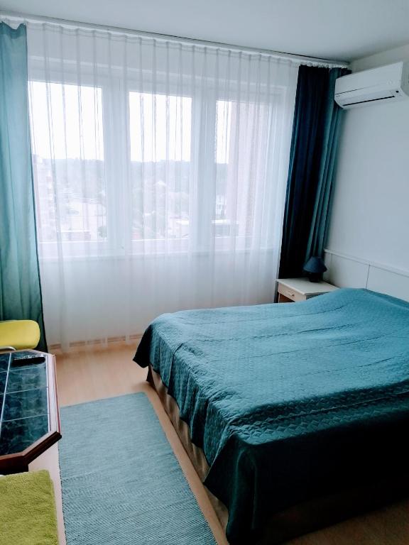 Posteľ alebo postele v izbe v ubytovaní Luna Apartman501