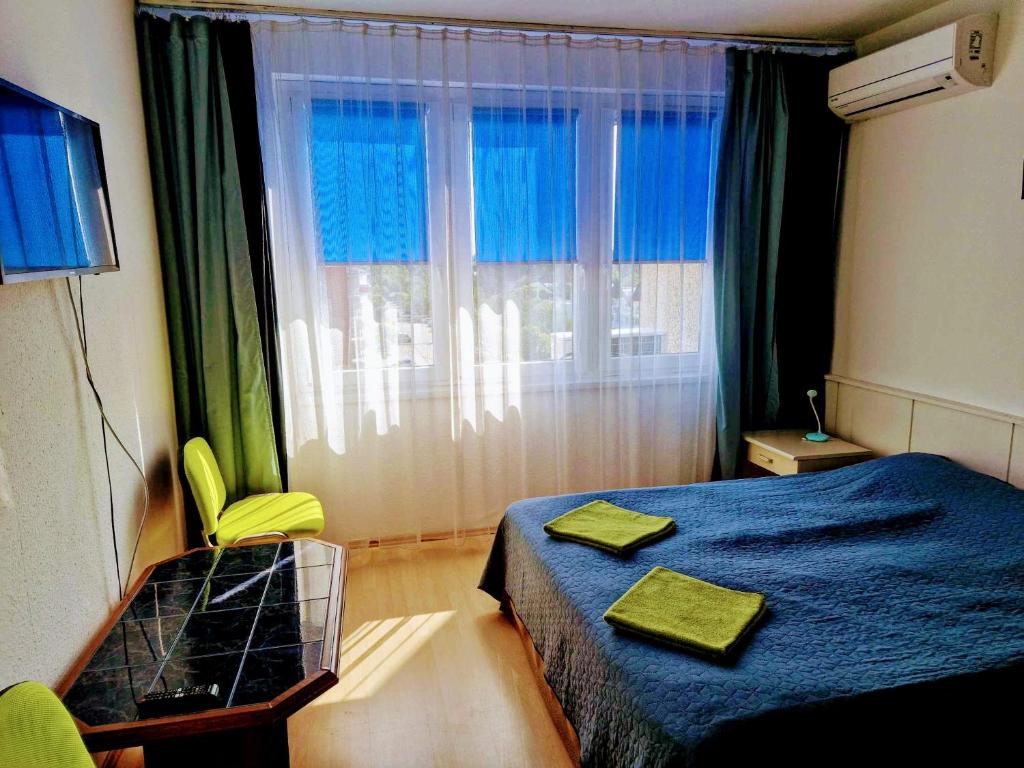 Posteľ alebo postele v izbe v ubytovaní Luna Apartman501
