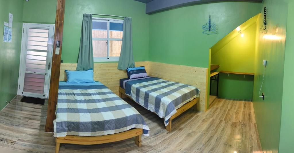 Postel nebo postele na pokoji v ubytování Ye Yin No84