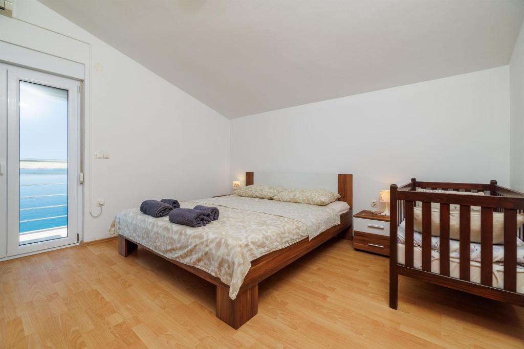 Posteľ alebo postele v izbe v ubytovaní Apartment Toma