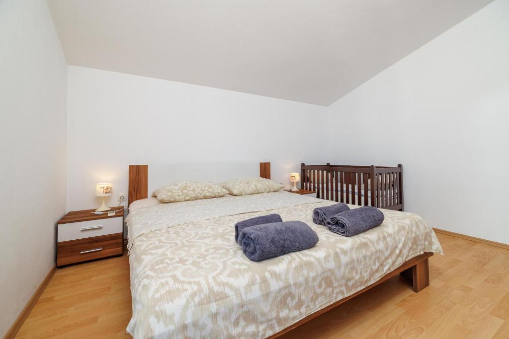 Posteľ alebo postele v izbe v ubytovaní Apartment Toma