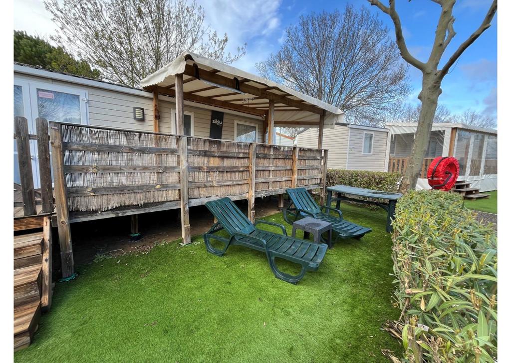 O grădină în afara Mobil-home - Clim, TV, LV, LL - Camping LA CARABASSE 4 étoiles - MH-A021