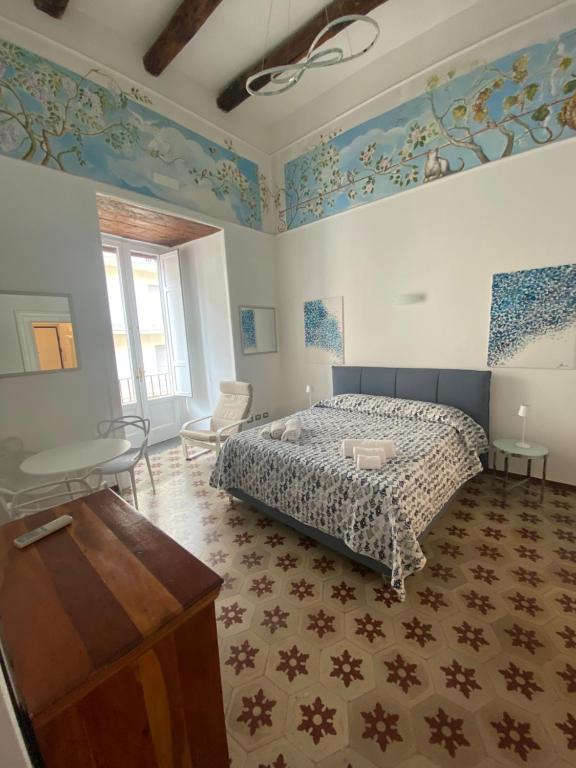 Ένα ή περισσότερα κρεβάτια σε δωμάτιο στο Casa Falcone