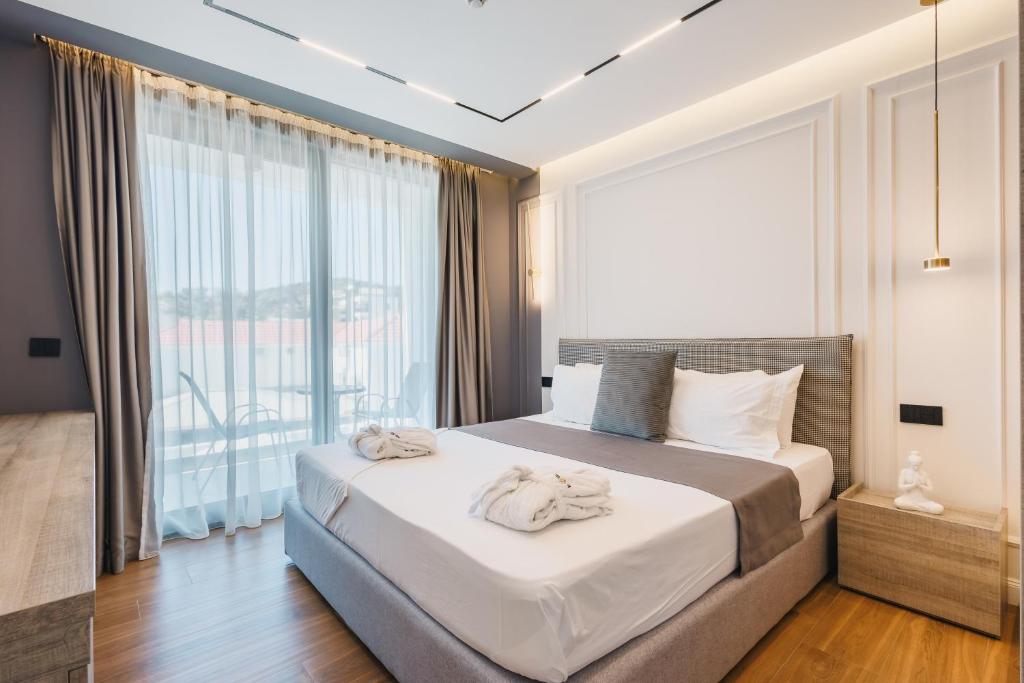 Voodi või voodid majutusasutuse Hotel Teuta toas