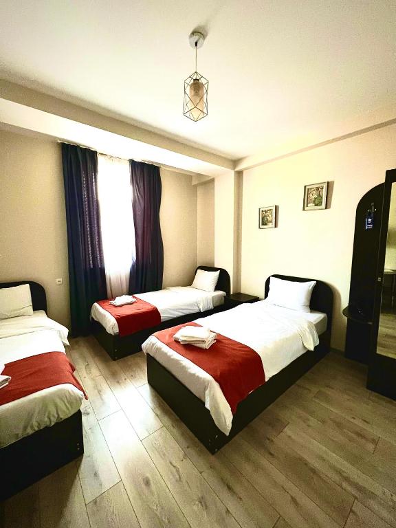 Postel nebo postele na pokoji v ubytování Hotel New Terrace