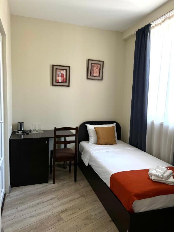 Postel nebo postele na pokoji v ubytování Hotel New Terrace