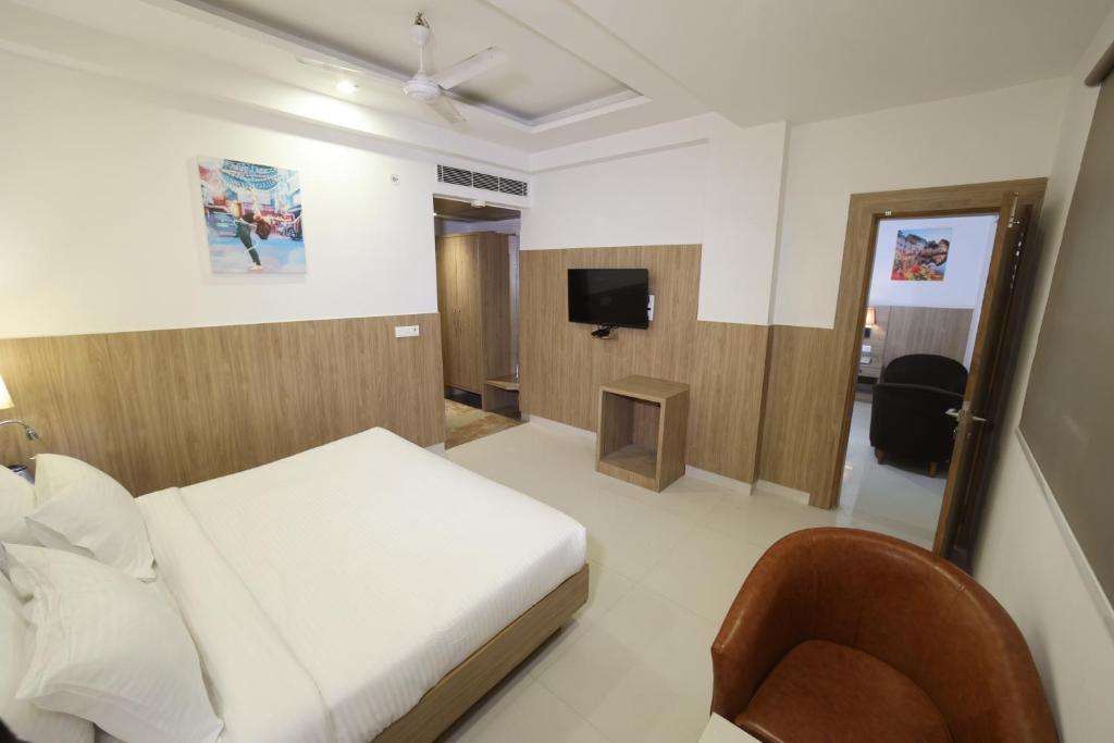 TV a/nebo společenská místnost v ubytování HOTEL CORPORATE PLAZA TERMINAL 3 Delhi AIRPORT