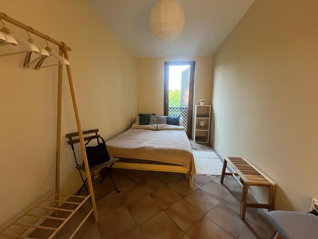 Postel nebo postele na pokoji v ubytování Csopak Strand Apartman