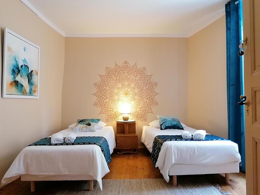 Postel nebo postele na pokoji v ubytování Autour d'une Toile