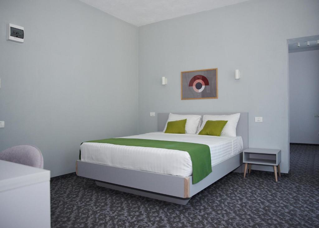 Postel nebo postele na pokoji v ubytování Astra Hotel