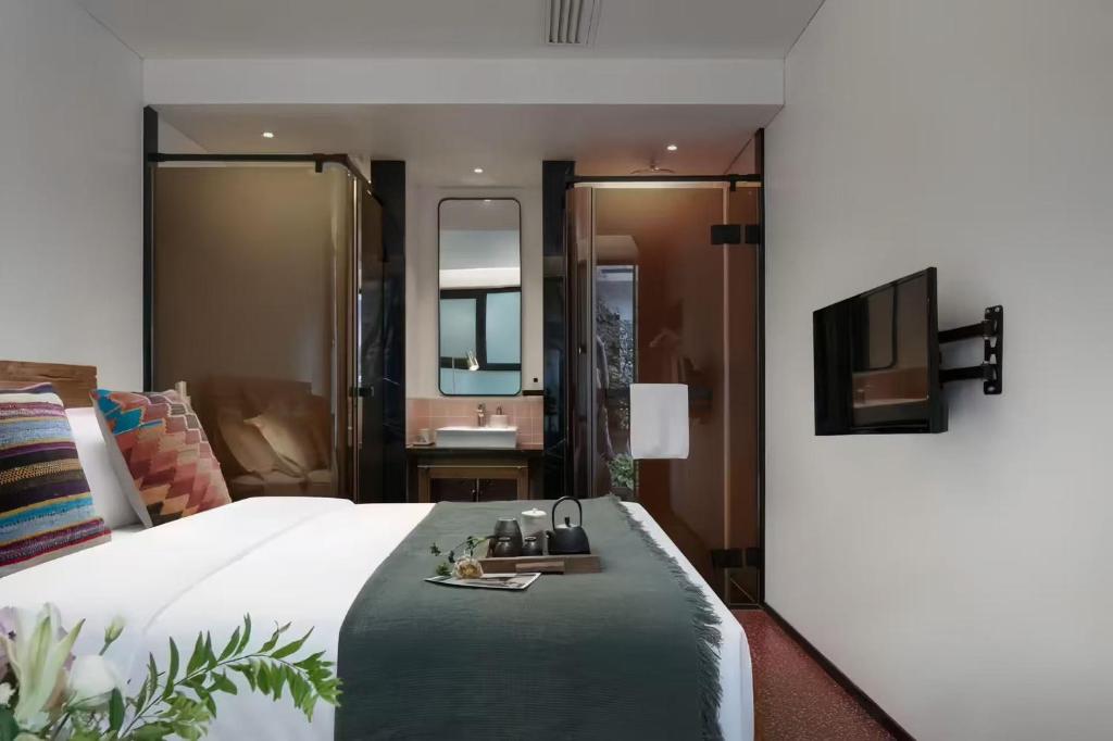 TV a/nebo společenská místnost v ubytování Peking Yard Boutique Hotel