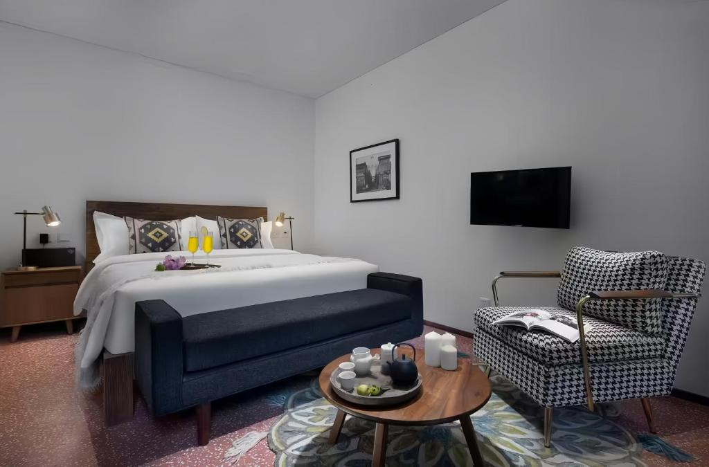 Postel nebo postele na pokoji v ubytování Peking Yard Boutique Hotel