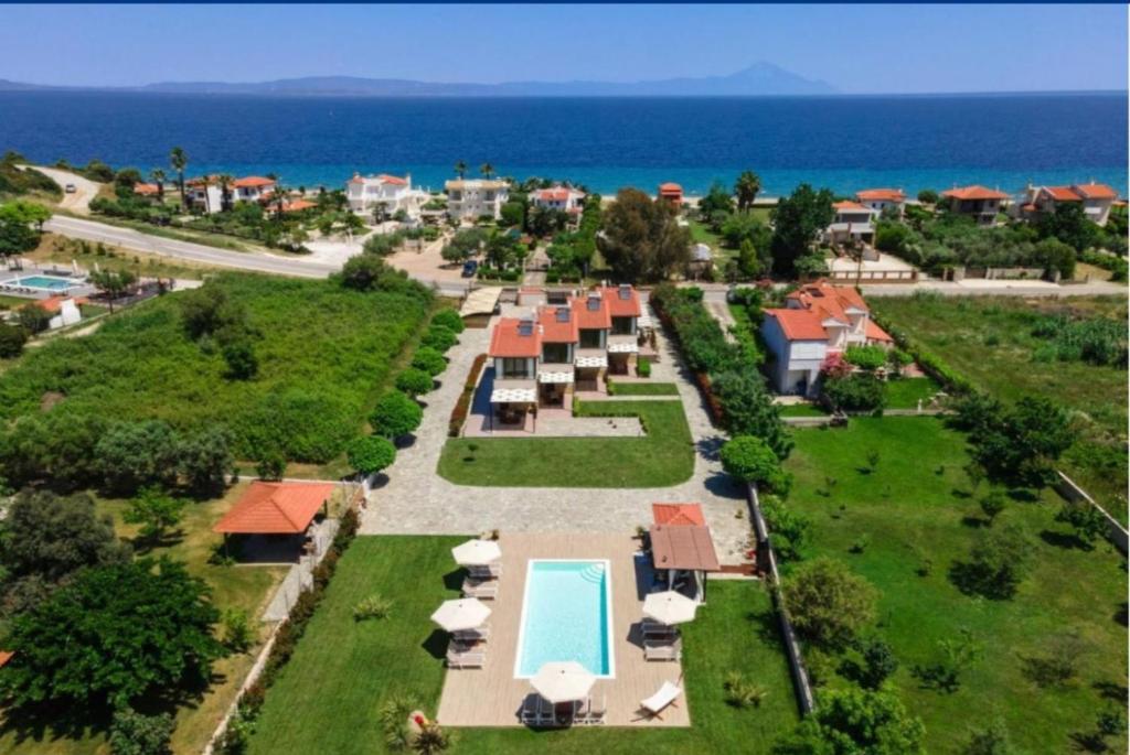 an aerial view of a resort with a swimming pool at Arteon villas in Akti Salonikiou