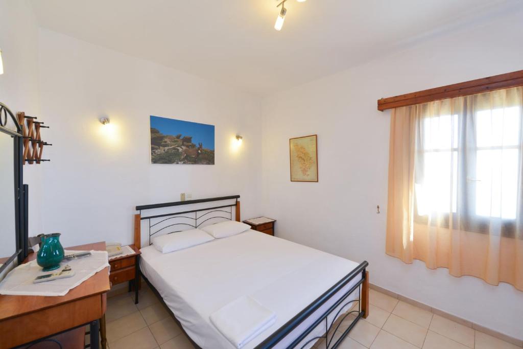 Postel nebo postele na pokoji v ubytování Windmill Villas