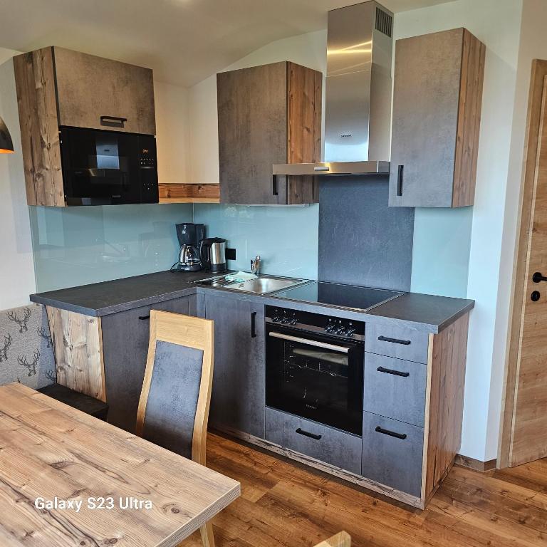 A kitchen or kitchenette at Appartementhaus Eisbauer