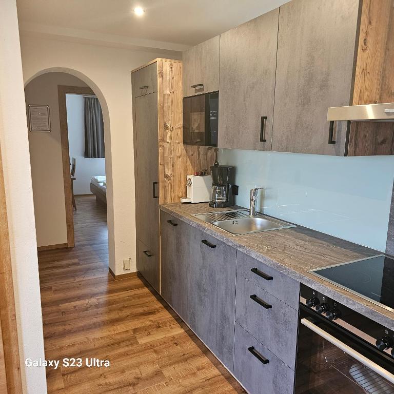 A kitchen or kitchenette at Appartementhaus Eisbauer