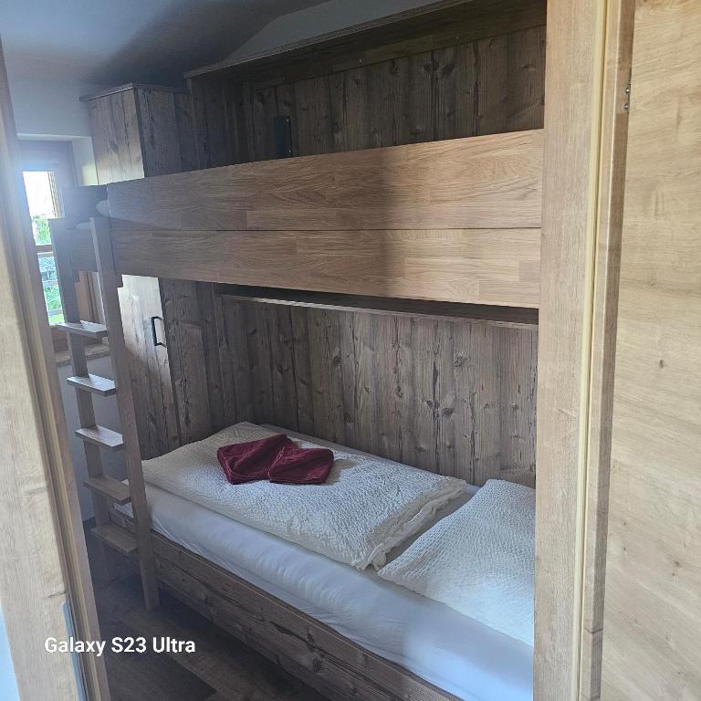 A bed or beds in a room at Appartementhaus Eisbauer