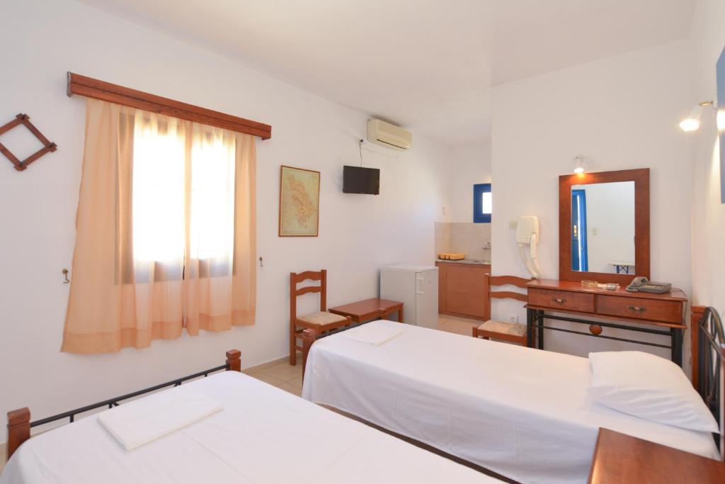 Postel nebo postele na pokoji v ubytování Windmill Villas