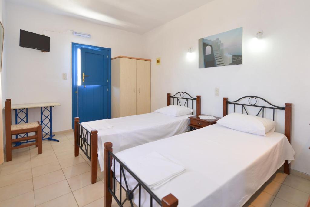 Postel nebo postele na pokoji v ubytování Windmill Villas