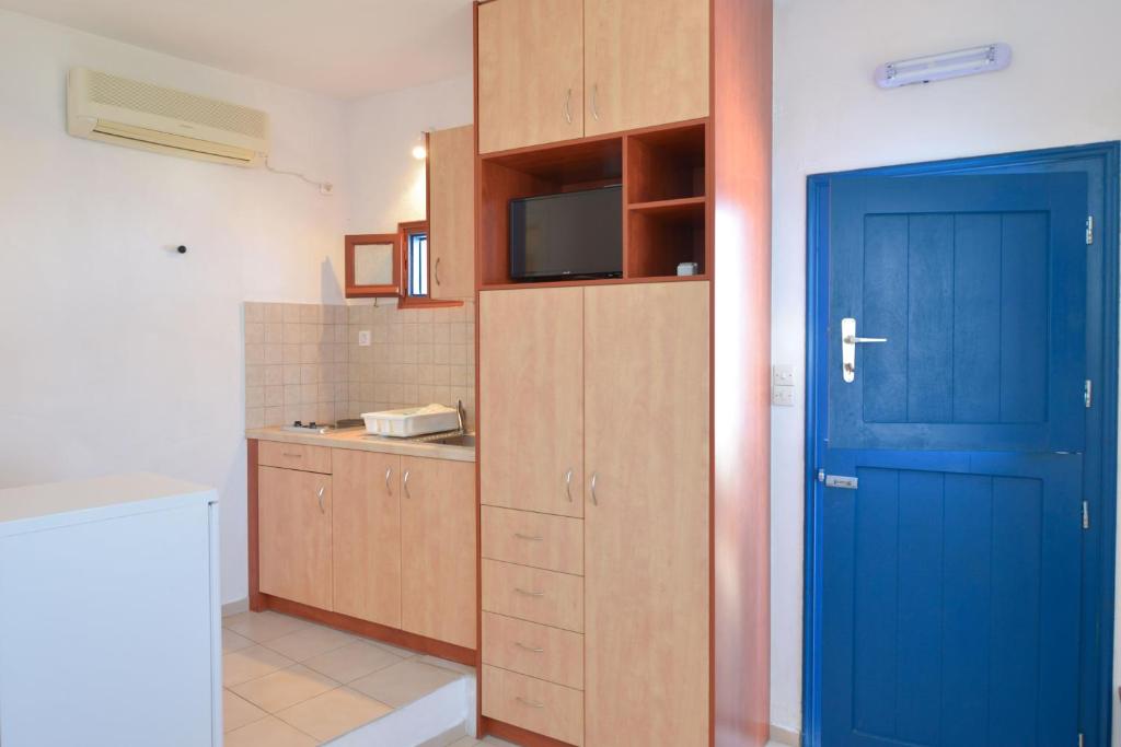 Kuchyň nebo kuchyňský kout v ubytování Windmill Villas
